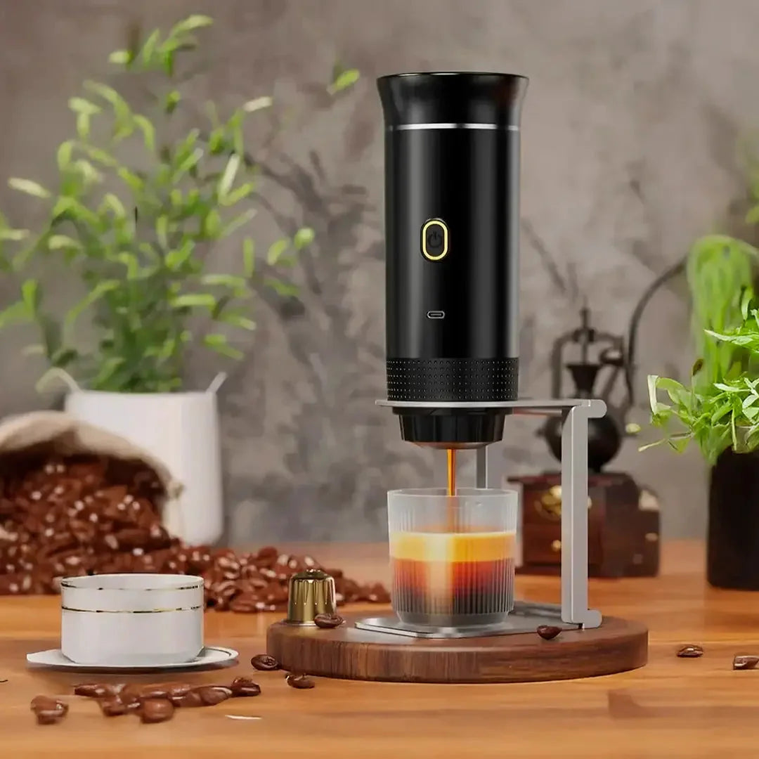 Hero shot of the Tazzi Portable Espresso Maker 3-in-1 actively brewing a shot of espresso outdoors — steam rising from the cup, highlighting portability and performance in any environment