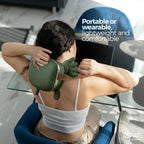 Person wearing the Tazzi RelaxingTouch massager around their neck while going about daily activities — portable, wireless, and wearable design demonstrated in an on-the-go lifestyle setting